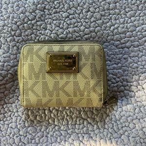 Michael Kors wallet, tan with gold detailing. Lots of pockets and space